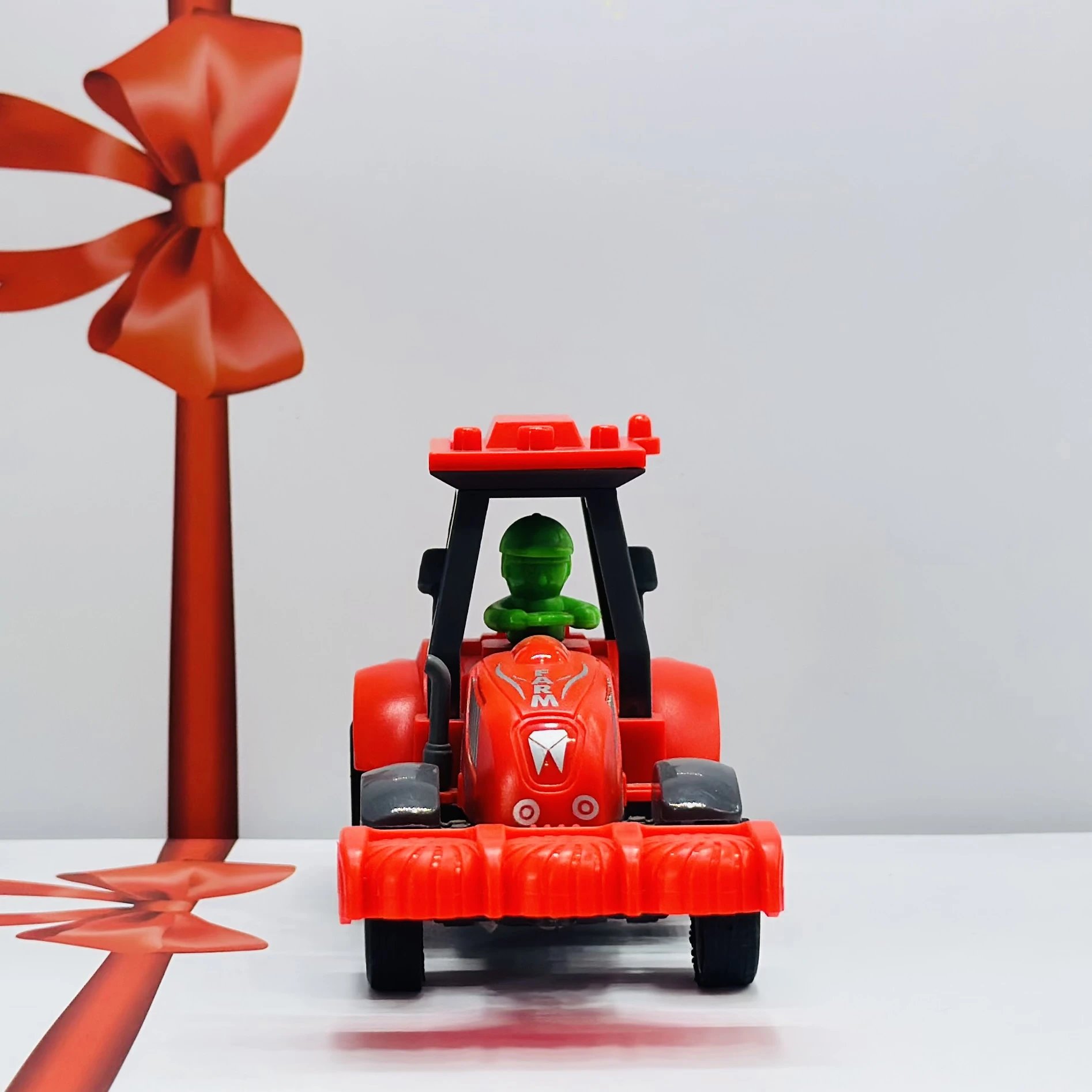 Red plastic toy tractor