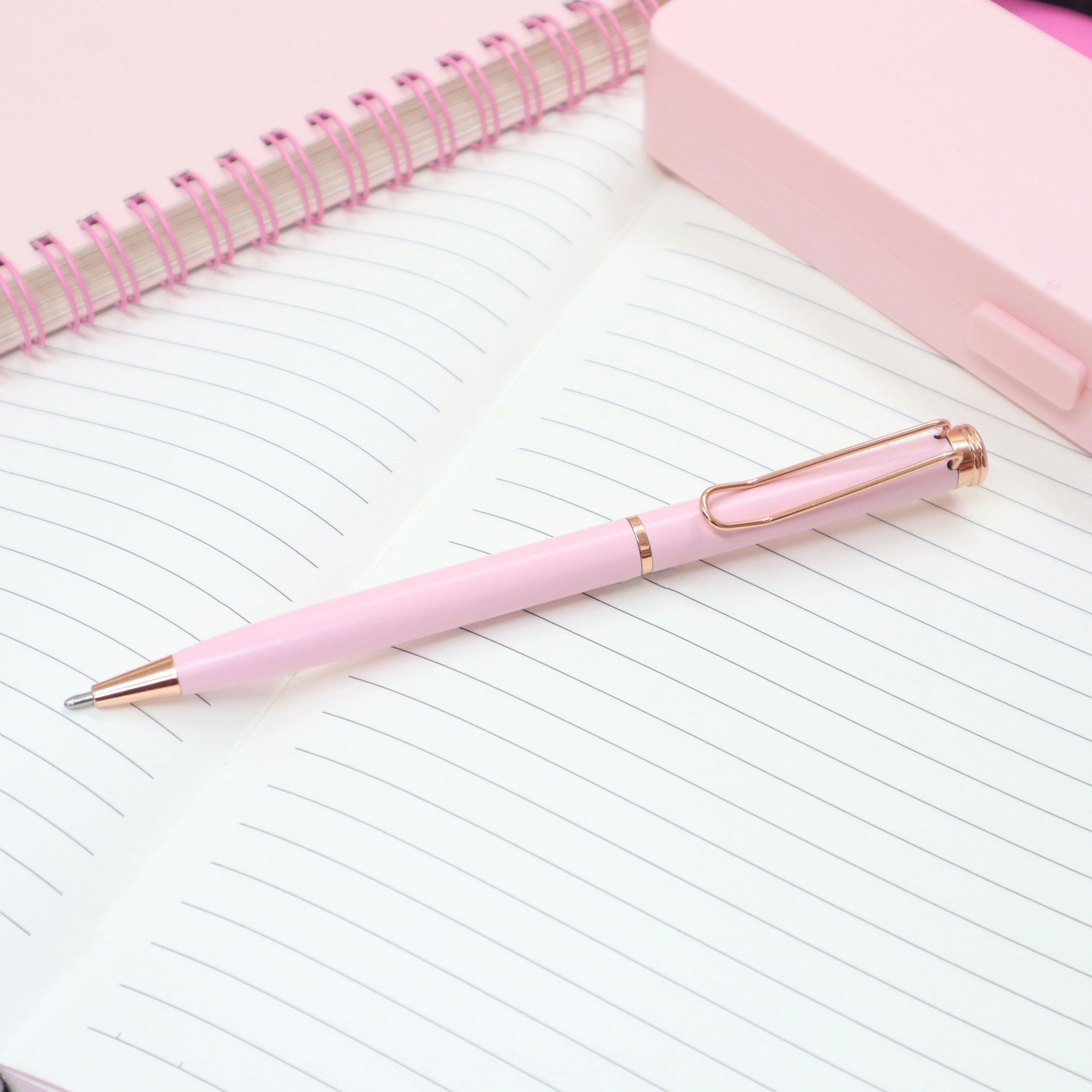 pink and rose gold ballpoint pen