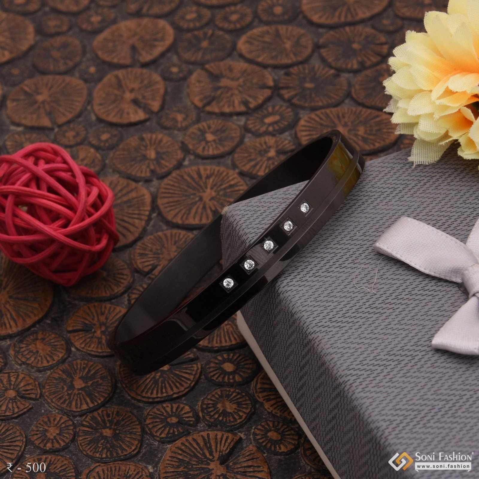 Black rhodium-plated bracelet with zircons, likely made of stainless steel.