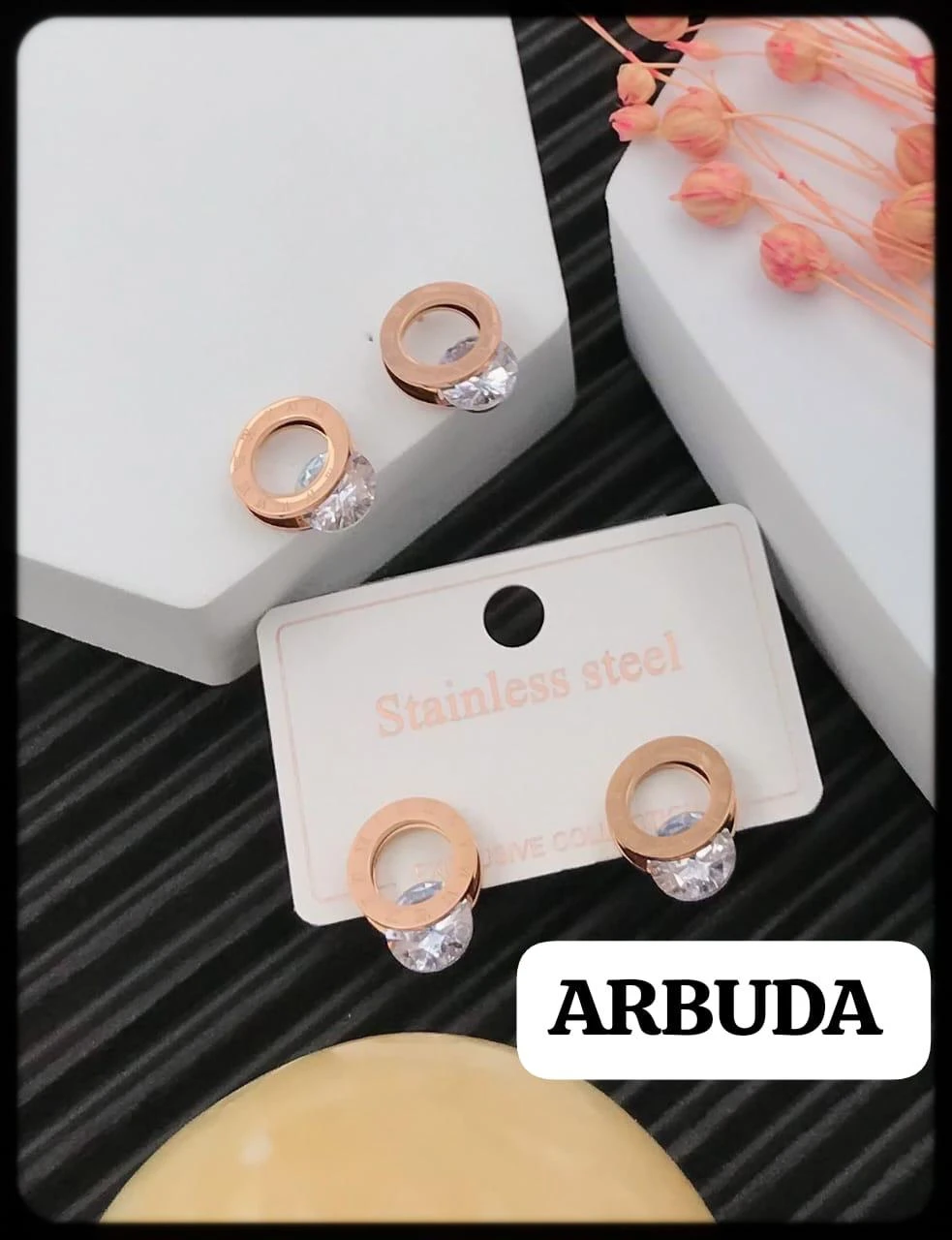 cubic zirconia rose gold titanium stud earrings.