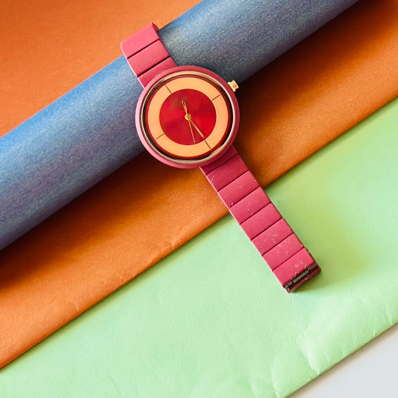 burgundy or red analogue watch for women, possibly from brands like Fastrack or Watchstar