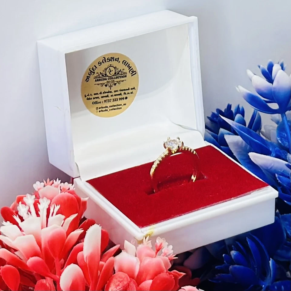 Gold and moissanite solitaire ring