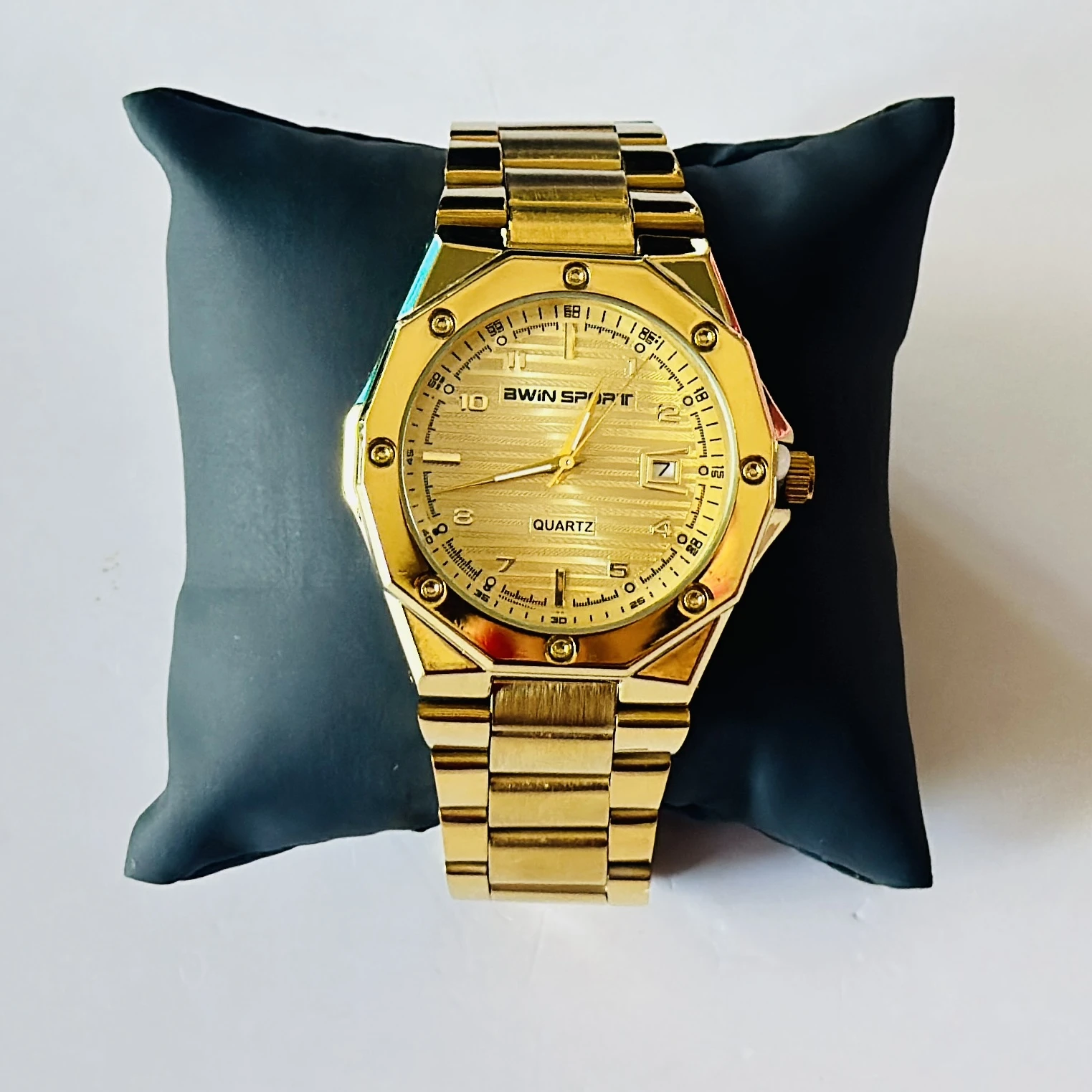 Gold toned watch is an AWIN SPORT quartz watch