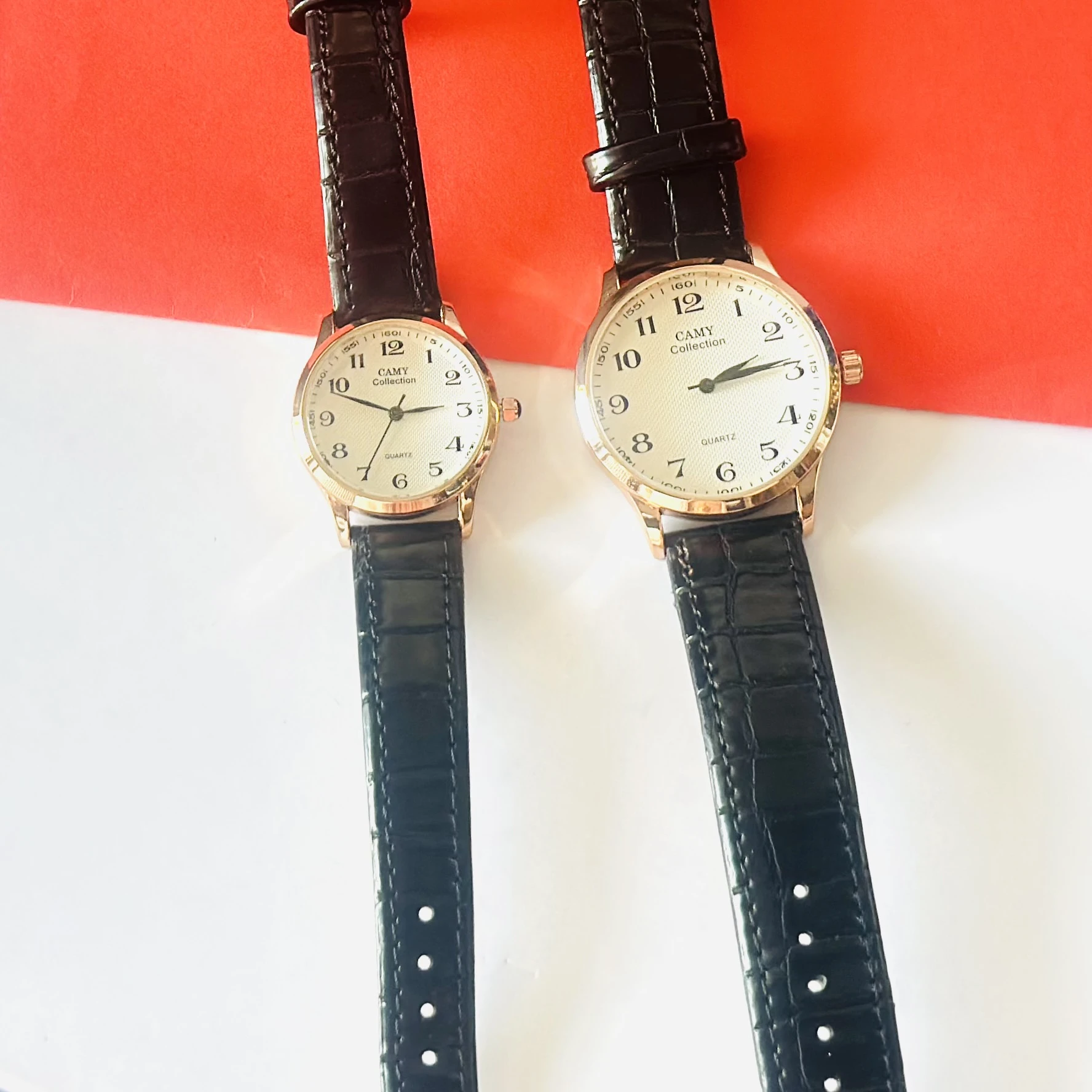 men's Camy Collection analog quartz watches with black leather straps and cream dials.