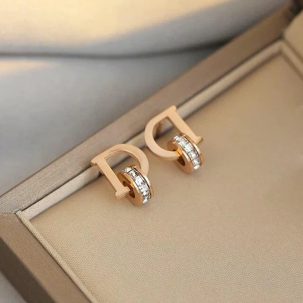 stainless steel CZ studded alphabetical letter "D" stud earrings.