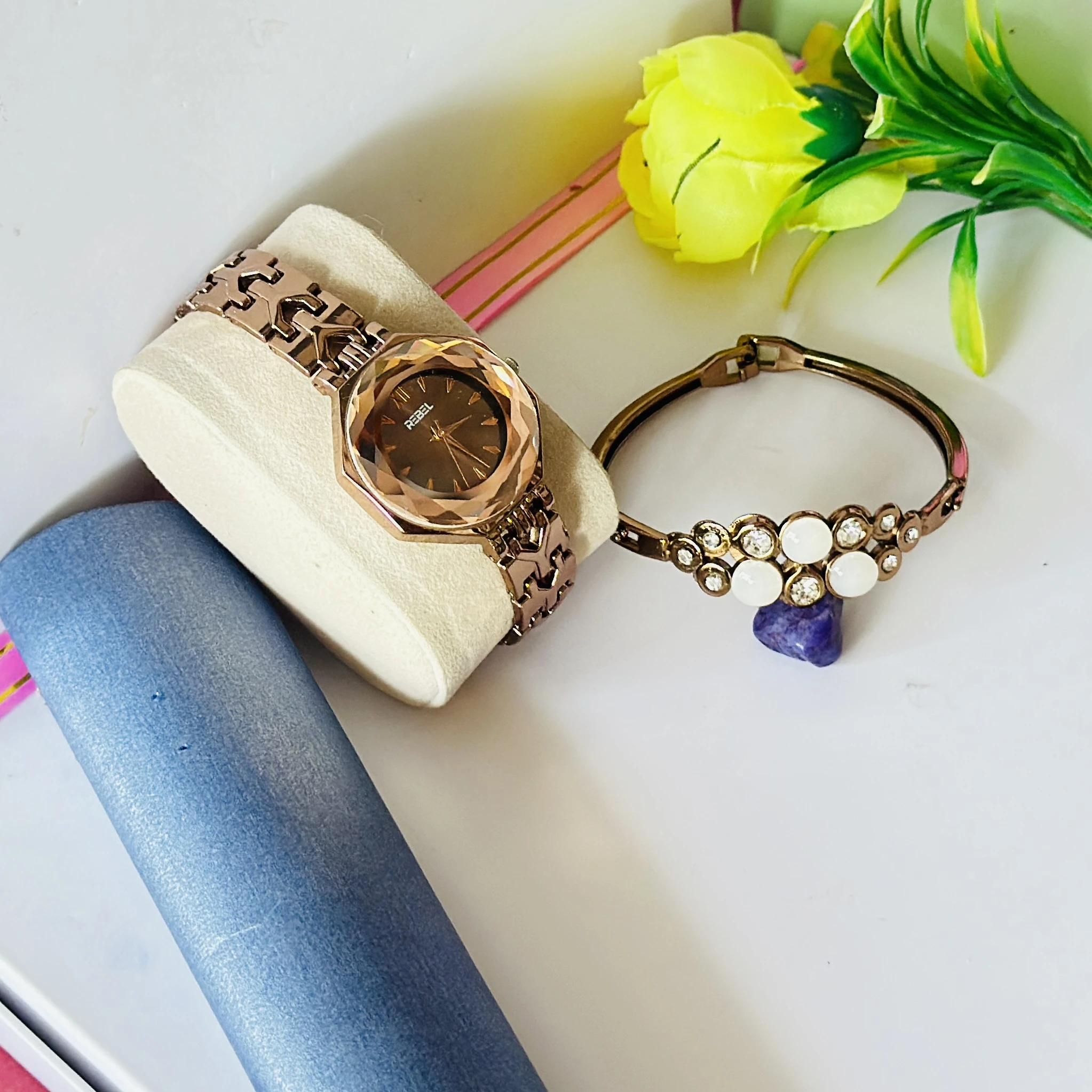 women's analog watch and a bracelet in rose gold tone