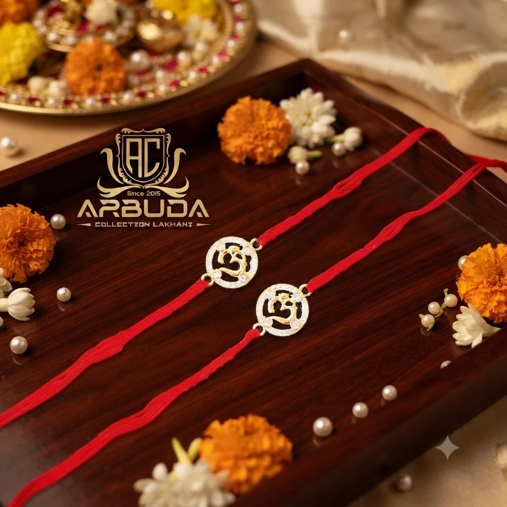 Silver Om-themed rakhis, featuring gold plating and stone studding.