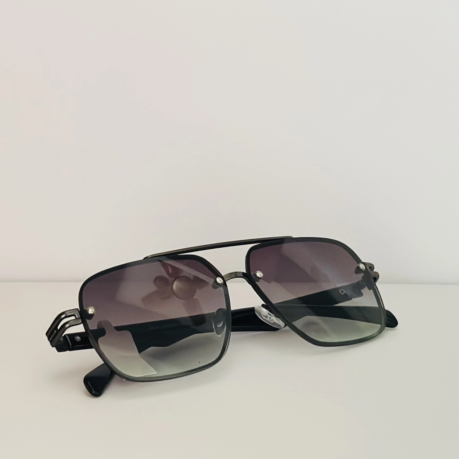 Ted Smith UV Protection Aviator sunglasses with a black metal frame and gradient lenses.