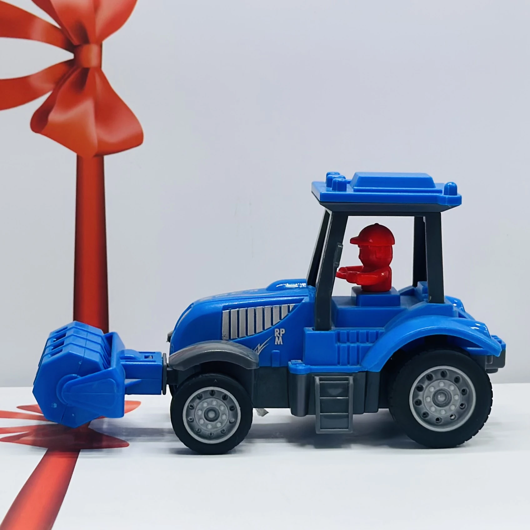 Blue plastic toy tractor
