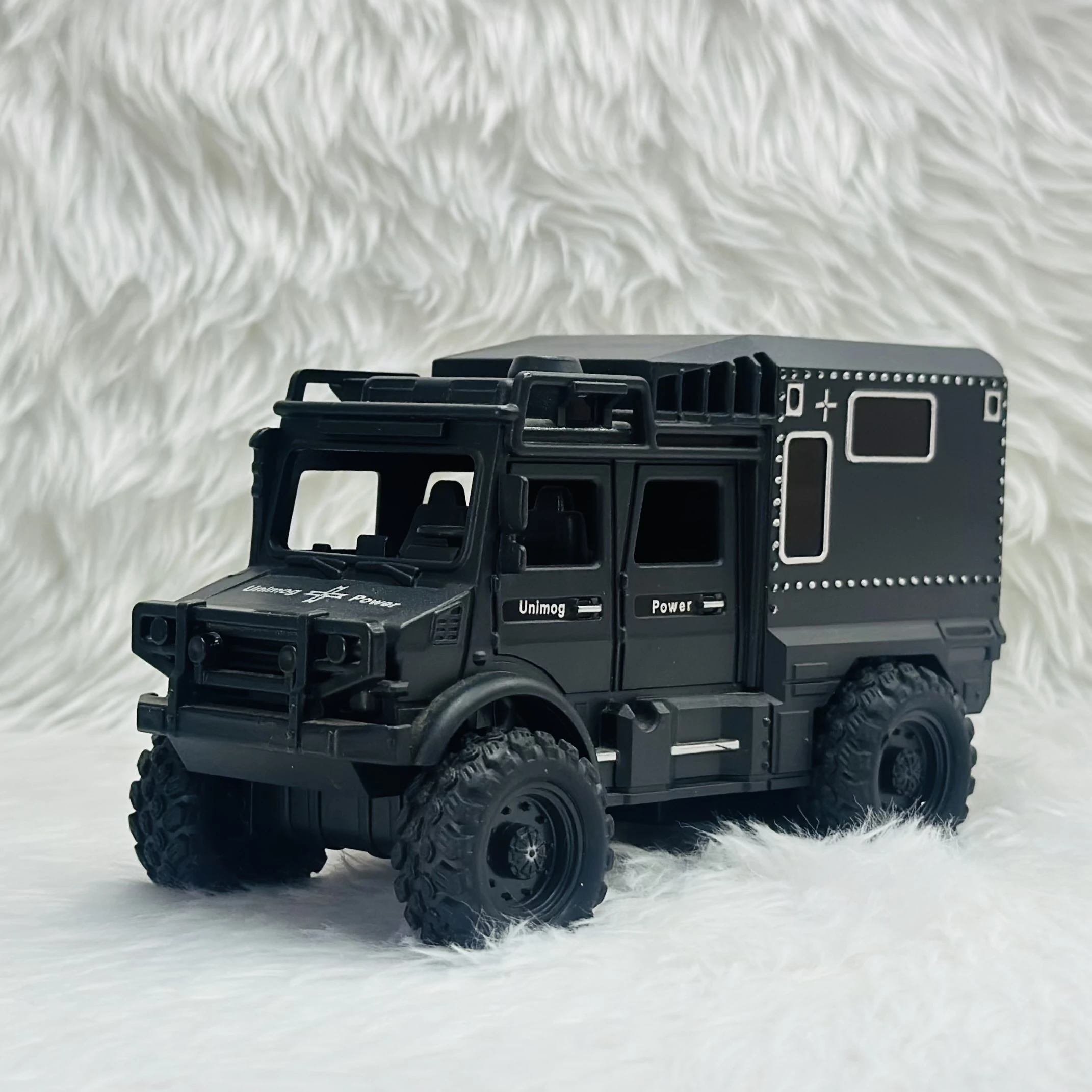 Toy Club Unimog army truck toy.