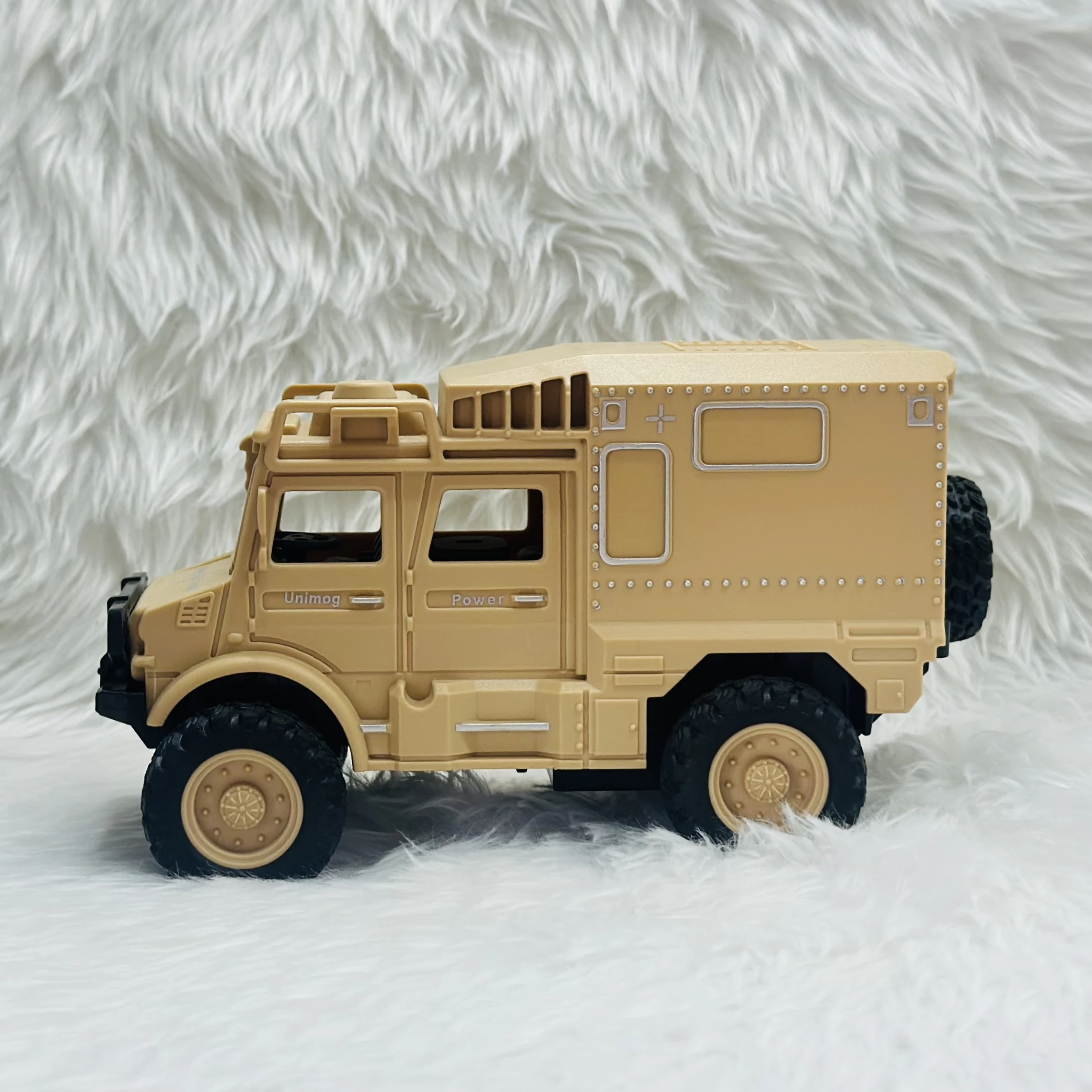 Toy Club Unimog army truck toy.