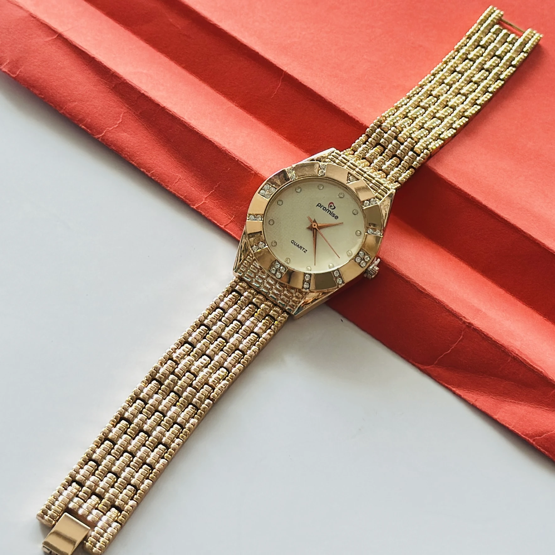 gold-toned Promise brand quartz women's watch