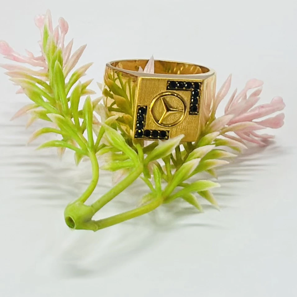 Men’s ring featuring the Mercedes-Benz logo and black accent stones