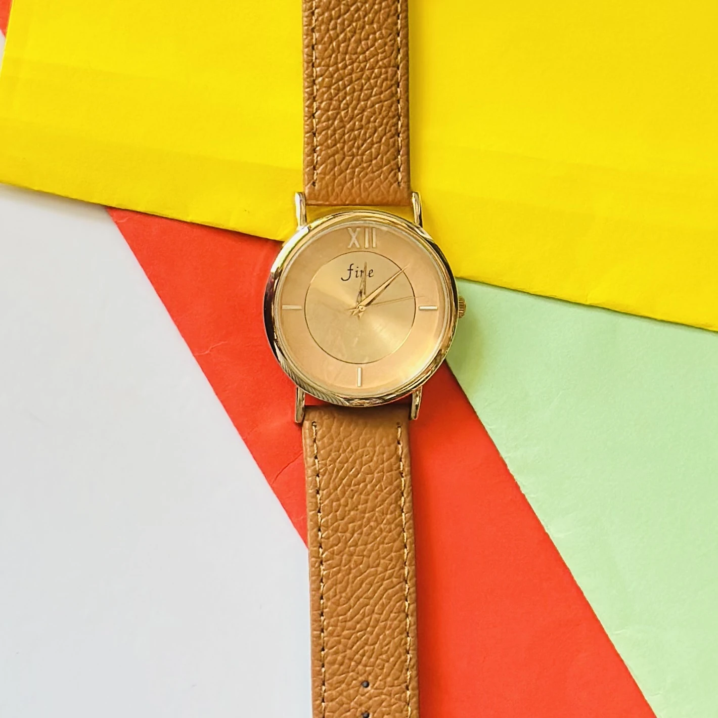 Jule Sun-Kissed watch with a tan faux leather strap and gold-toned details.