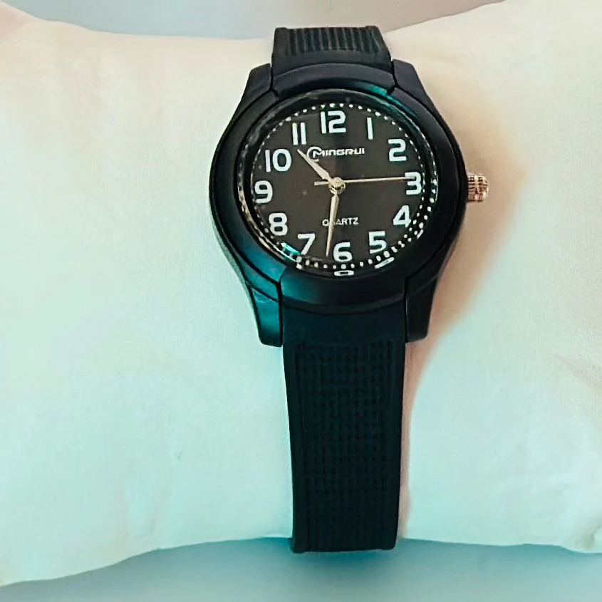 Edillas Kids Analog Watch with a mint green silicone strap.