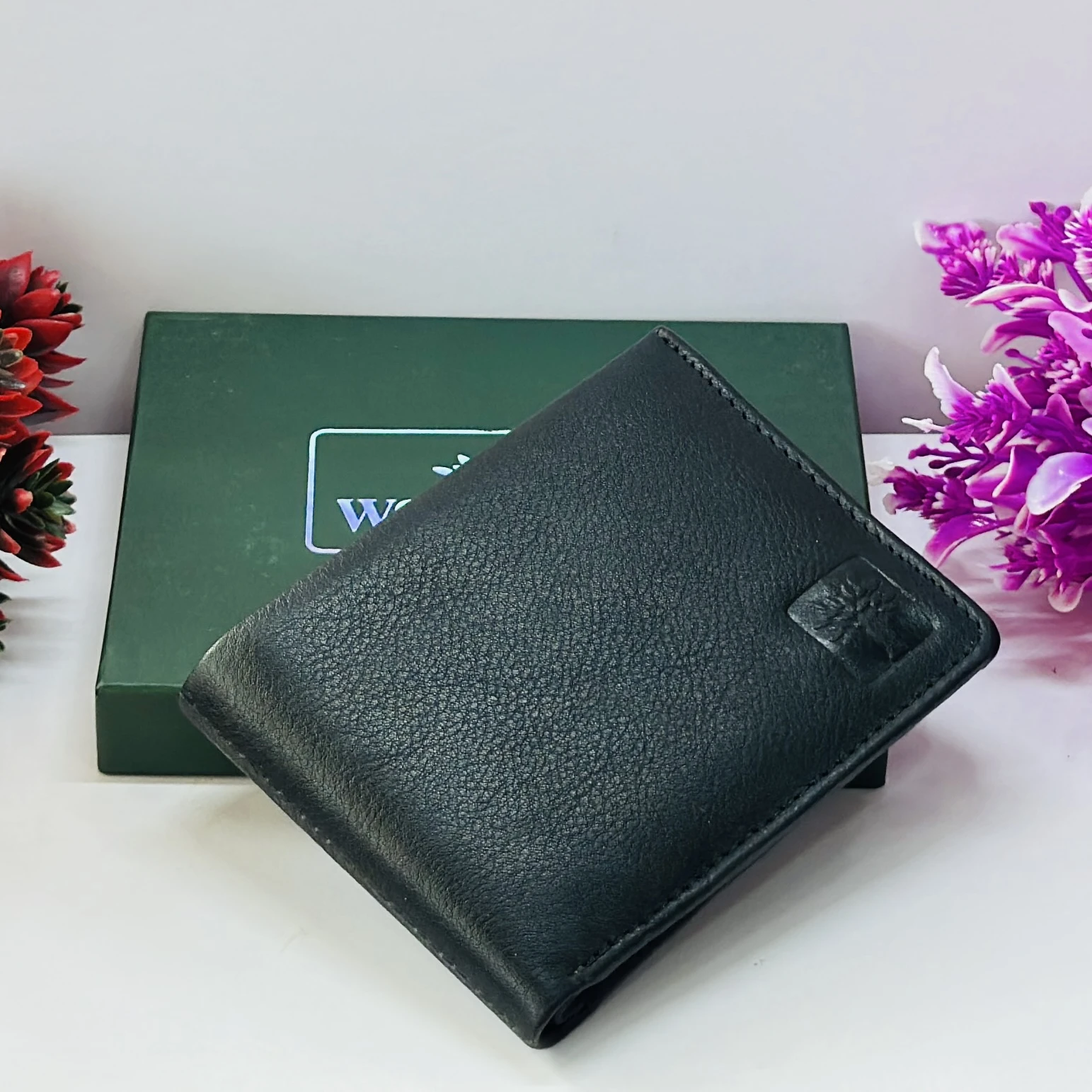 Woodland Men's black genuine leather bi-fold wallet.