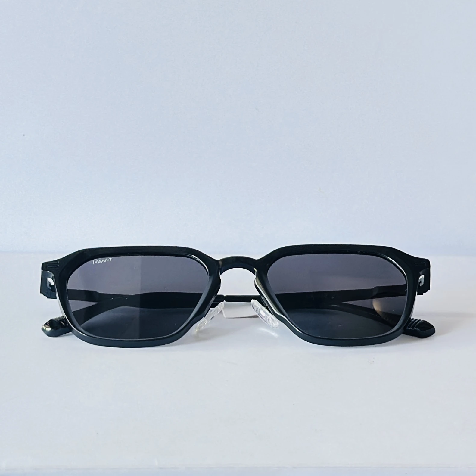 Rav-7 sunglasses feature a retro square black metal frame