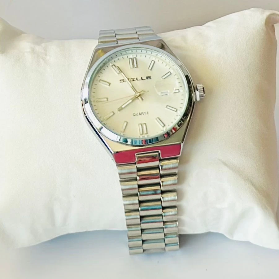 Snille analog quartz watch with a white dial and silver stainless steel strap.
