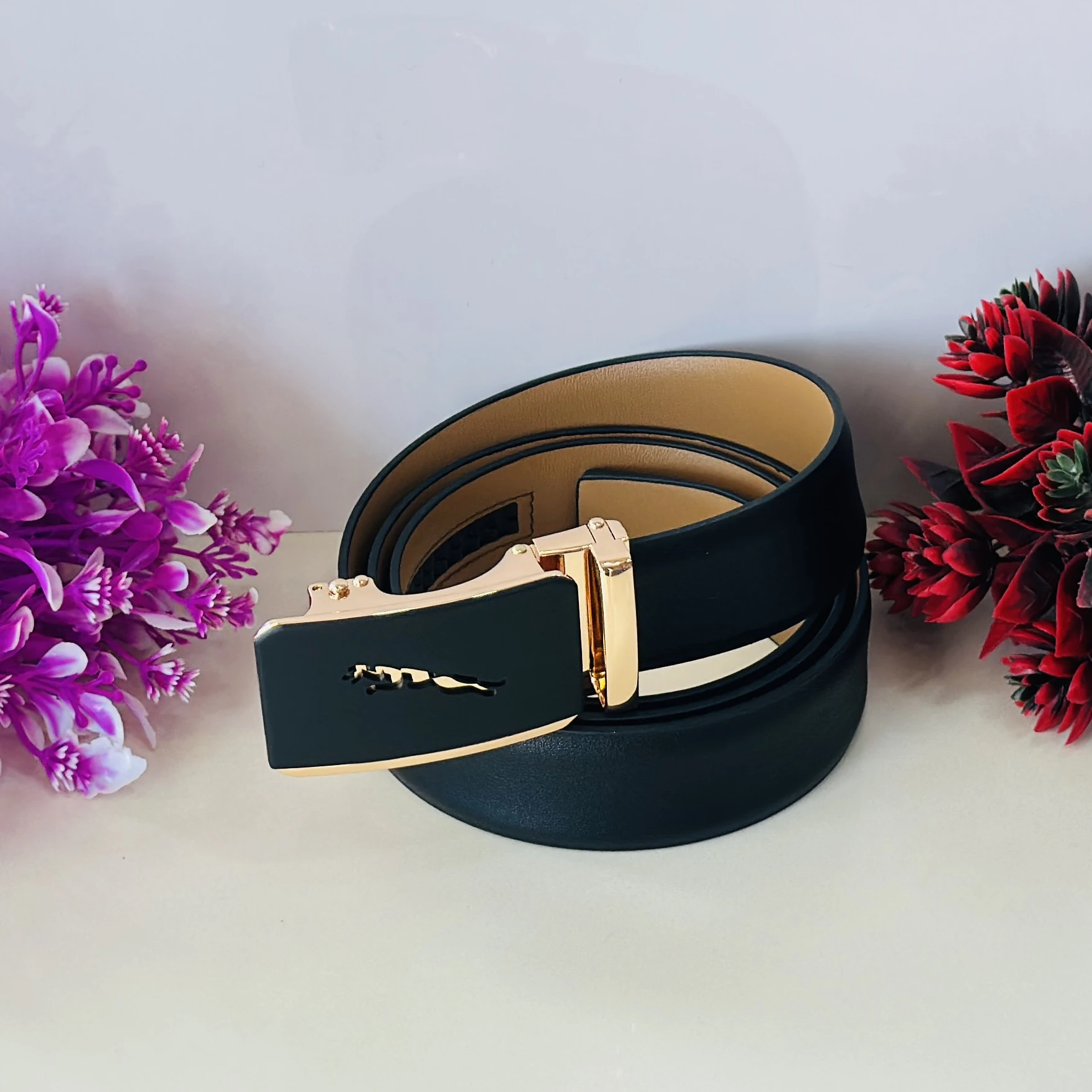 Black genuine or synthetic leather men's belt