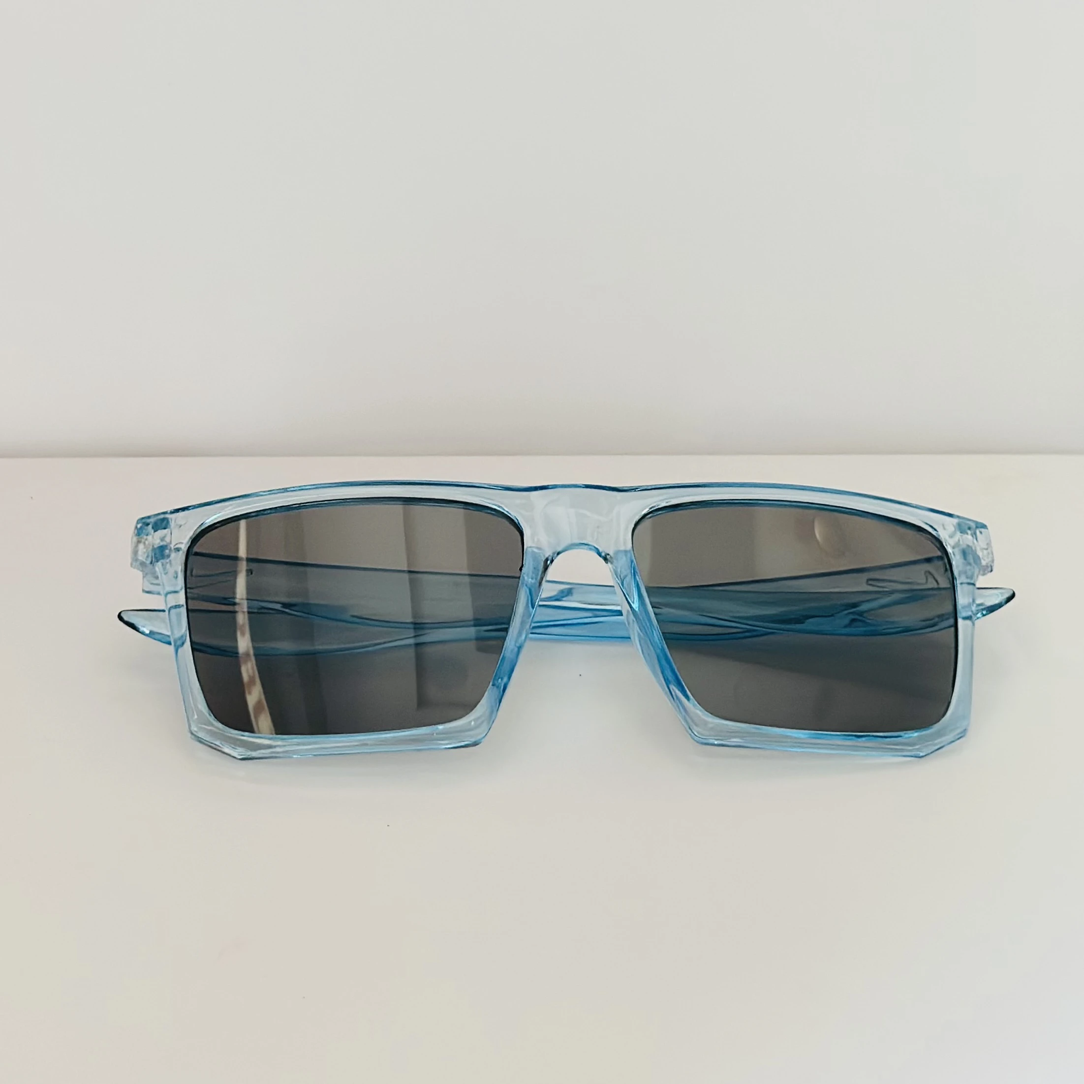 Voyage polarized sunglasses with a blue frame and black lenses.