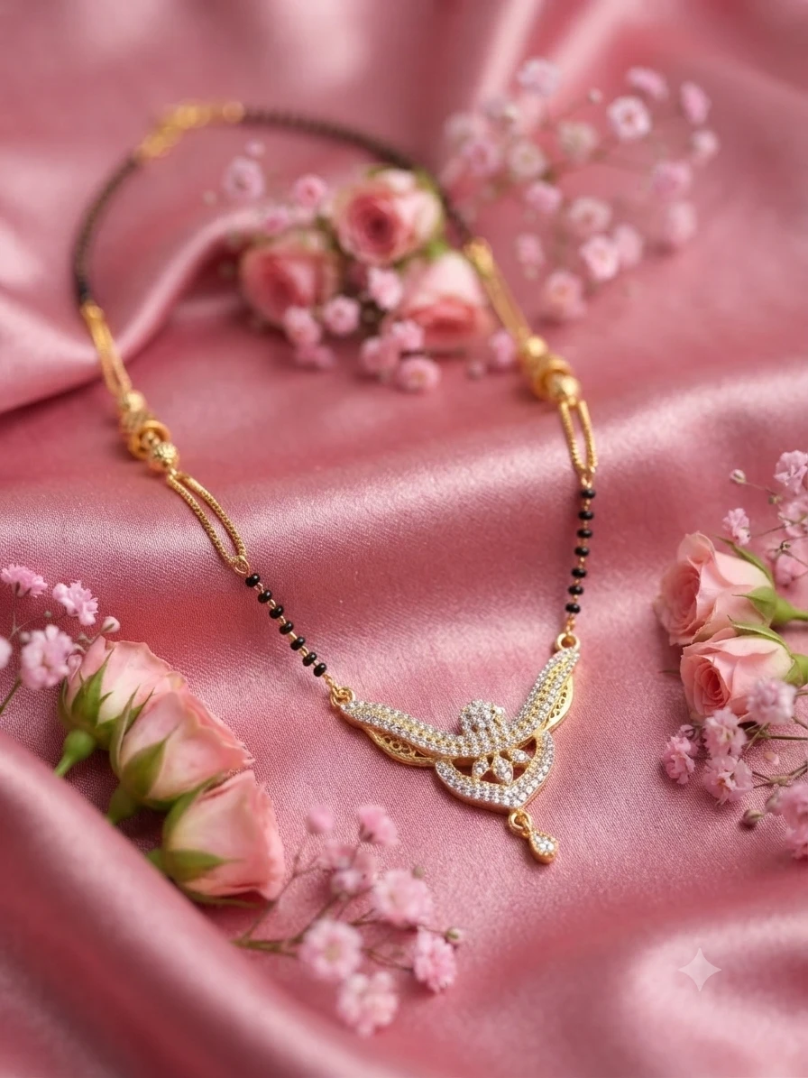 gold-plated mangalsutra features a delicate geometric pendant adorned with sparkling stones.