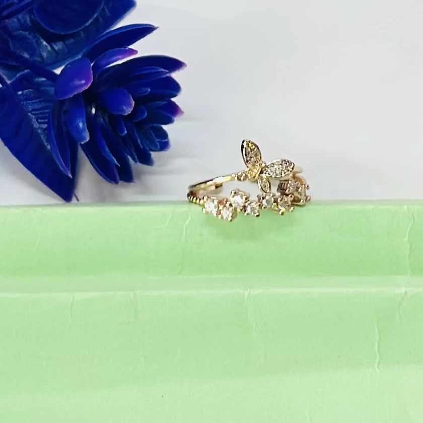 Gold plated alloy butterfly ring with a vintage style and clear stones.