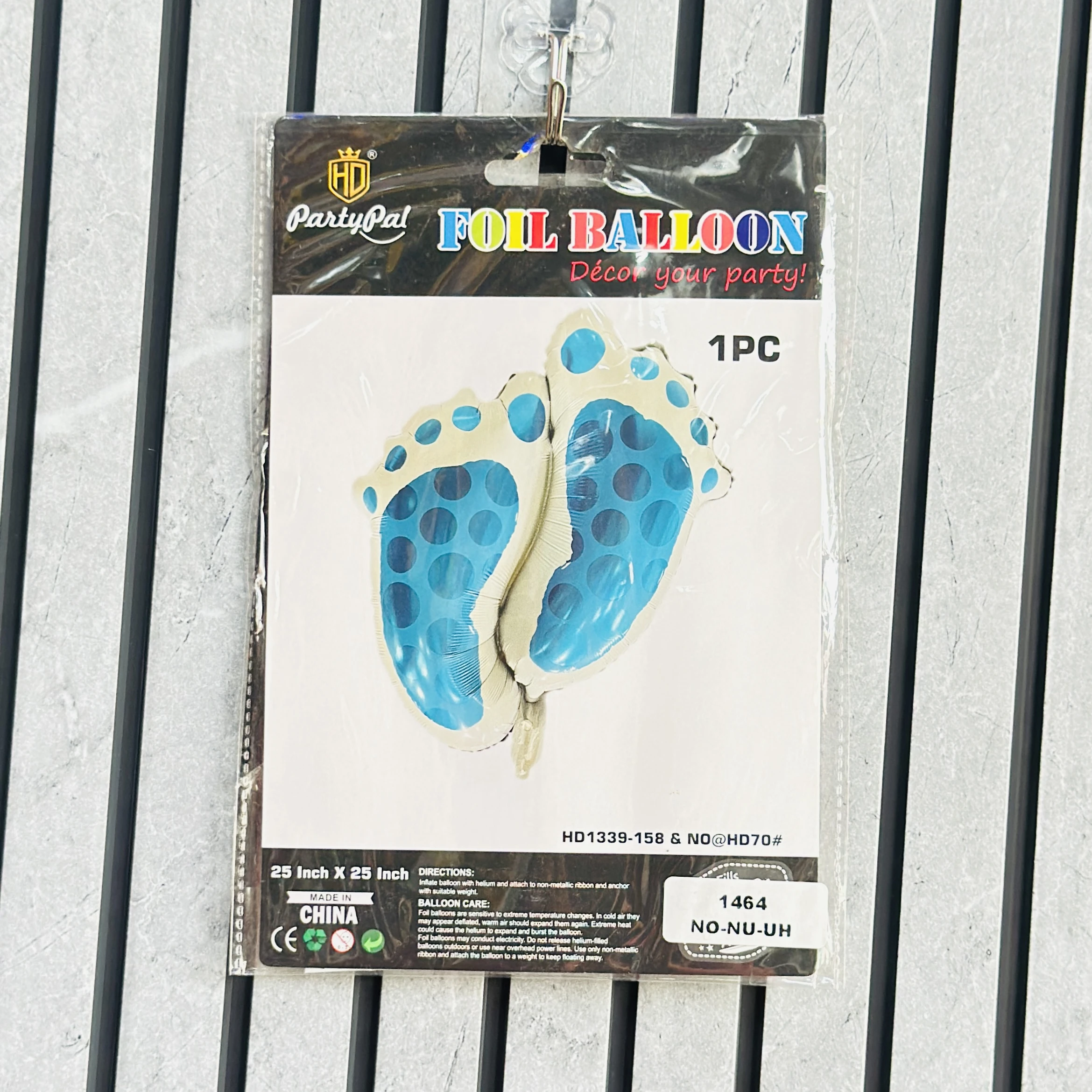 PartyPal baby footprint shaped blue and white foil balloon for baby shower decorations.