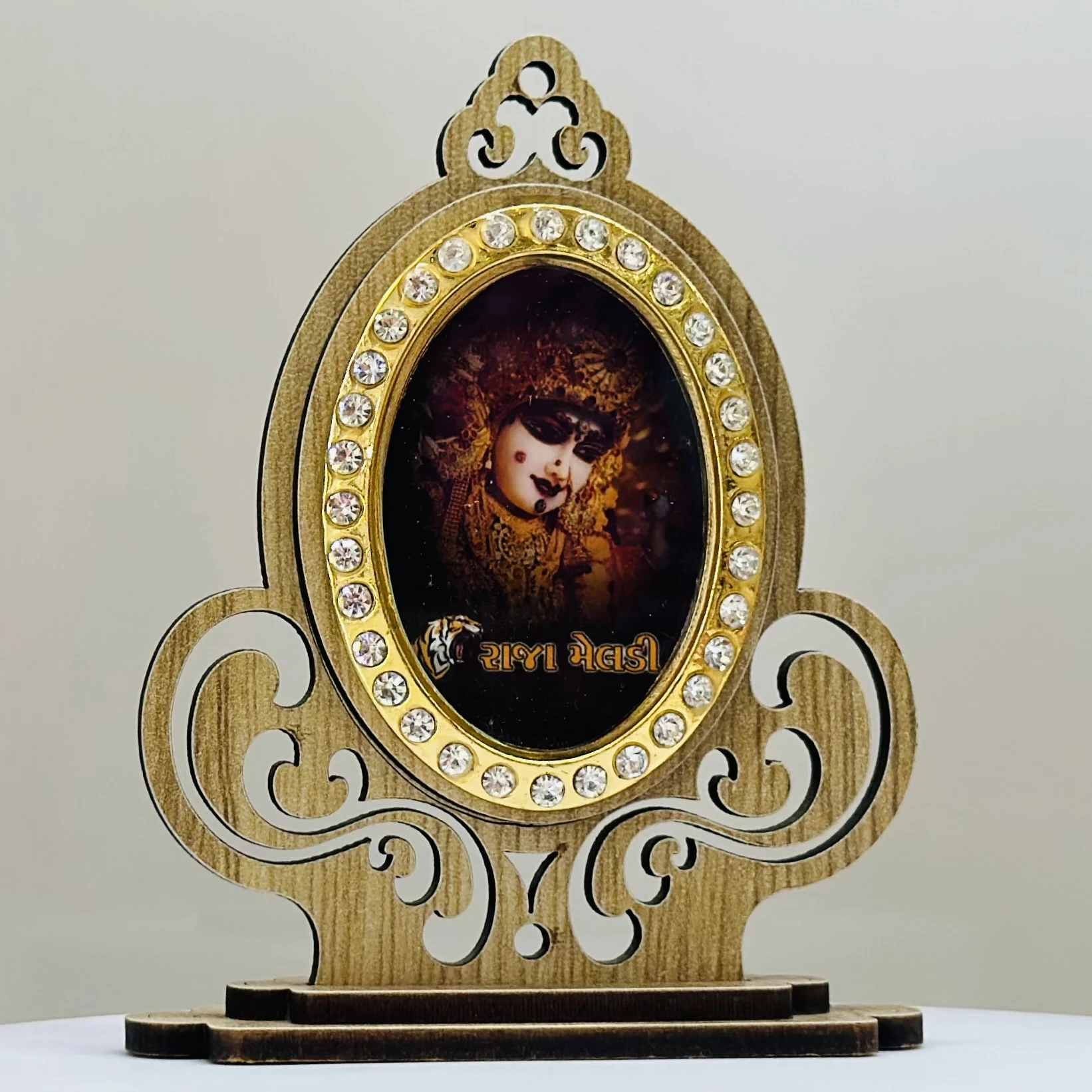 wooden showpiece featuring the Hindu deity Raja Meldi