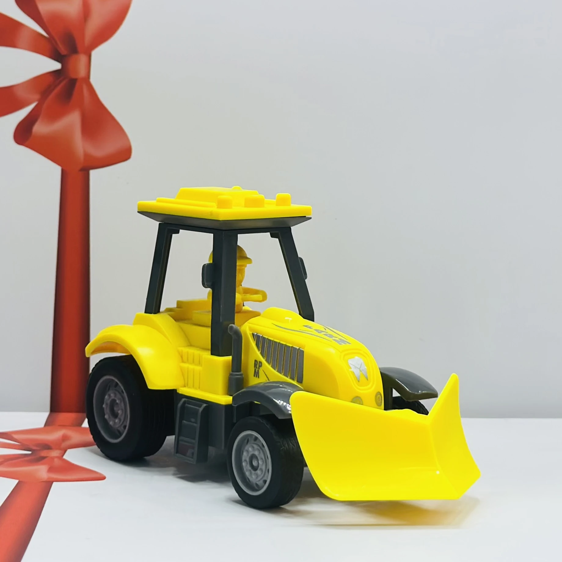 Yellow plastic toy tractor