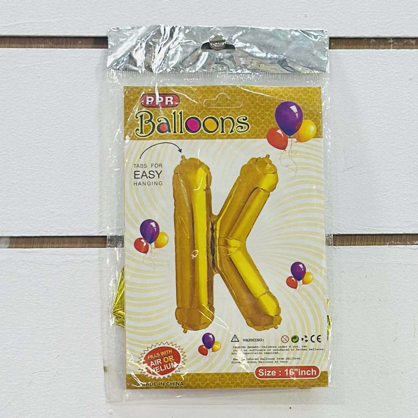 Gold foil letter "K”  balloon