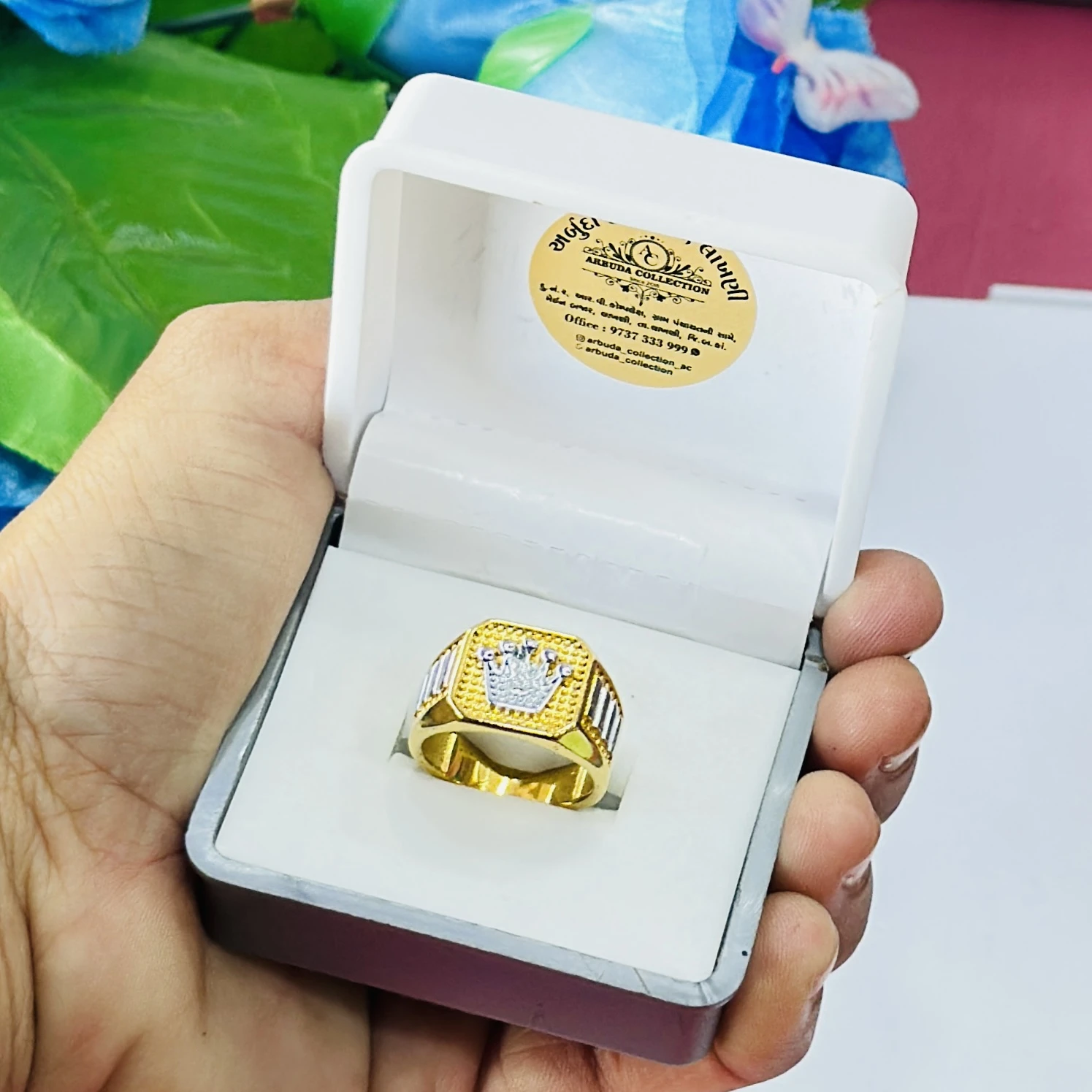 Gold toned men's crown ring