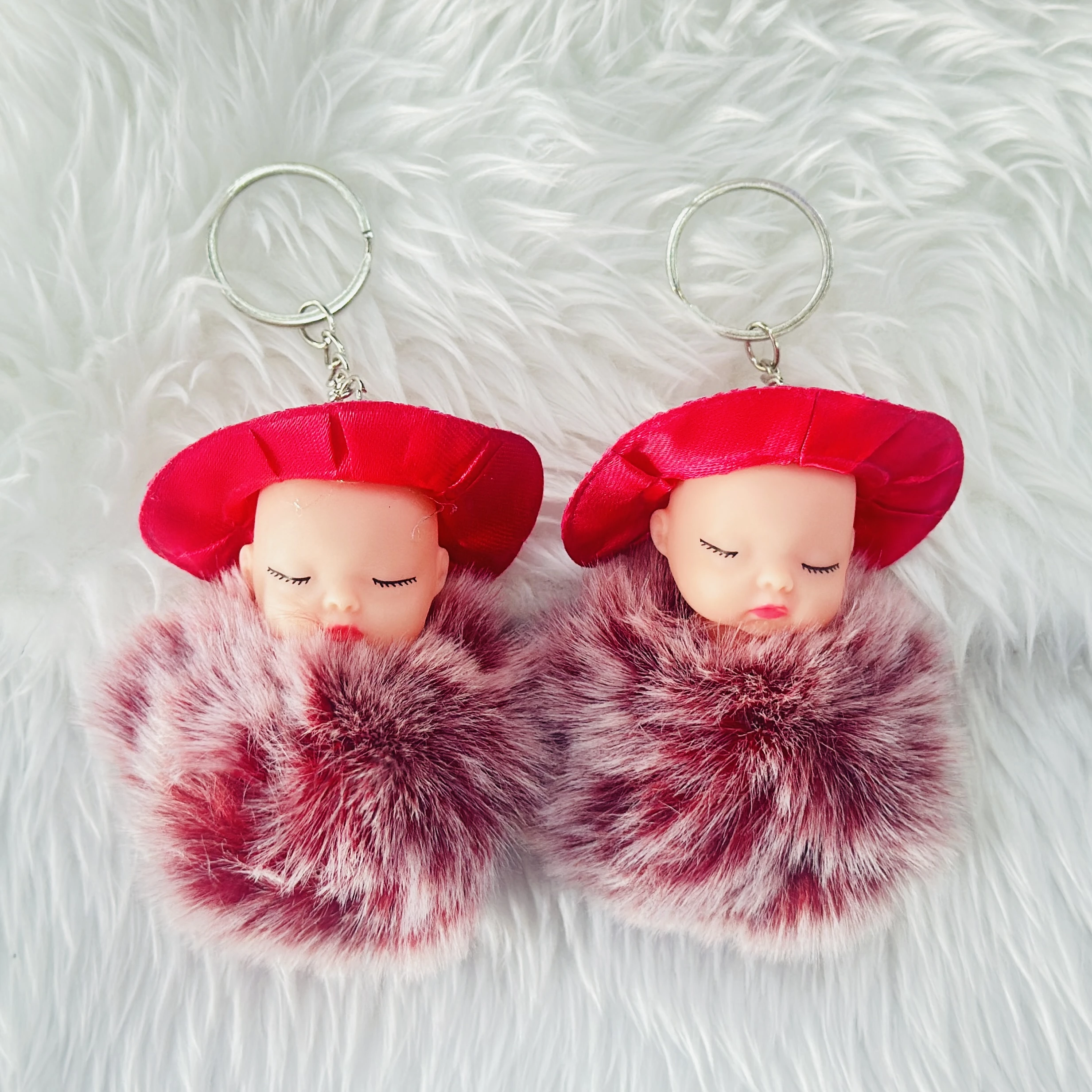 sleeping baby doll fluffy pom pom keychain