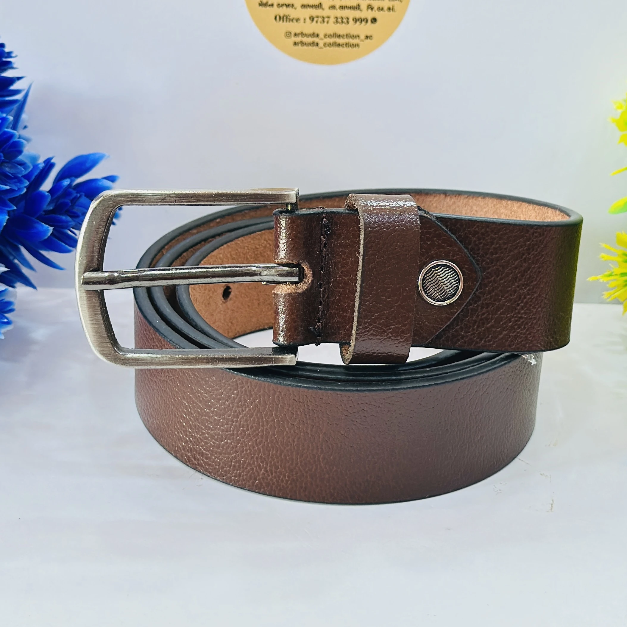 branded belt is a brown, textured men's formal leather