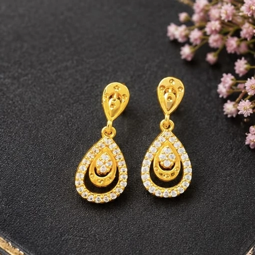 gold-plated Aurelia drop earrings feature a sparkling teardrop design