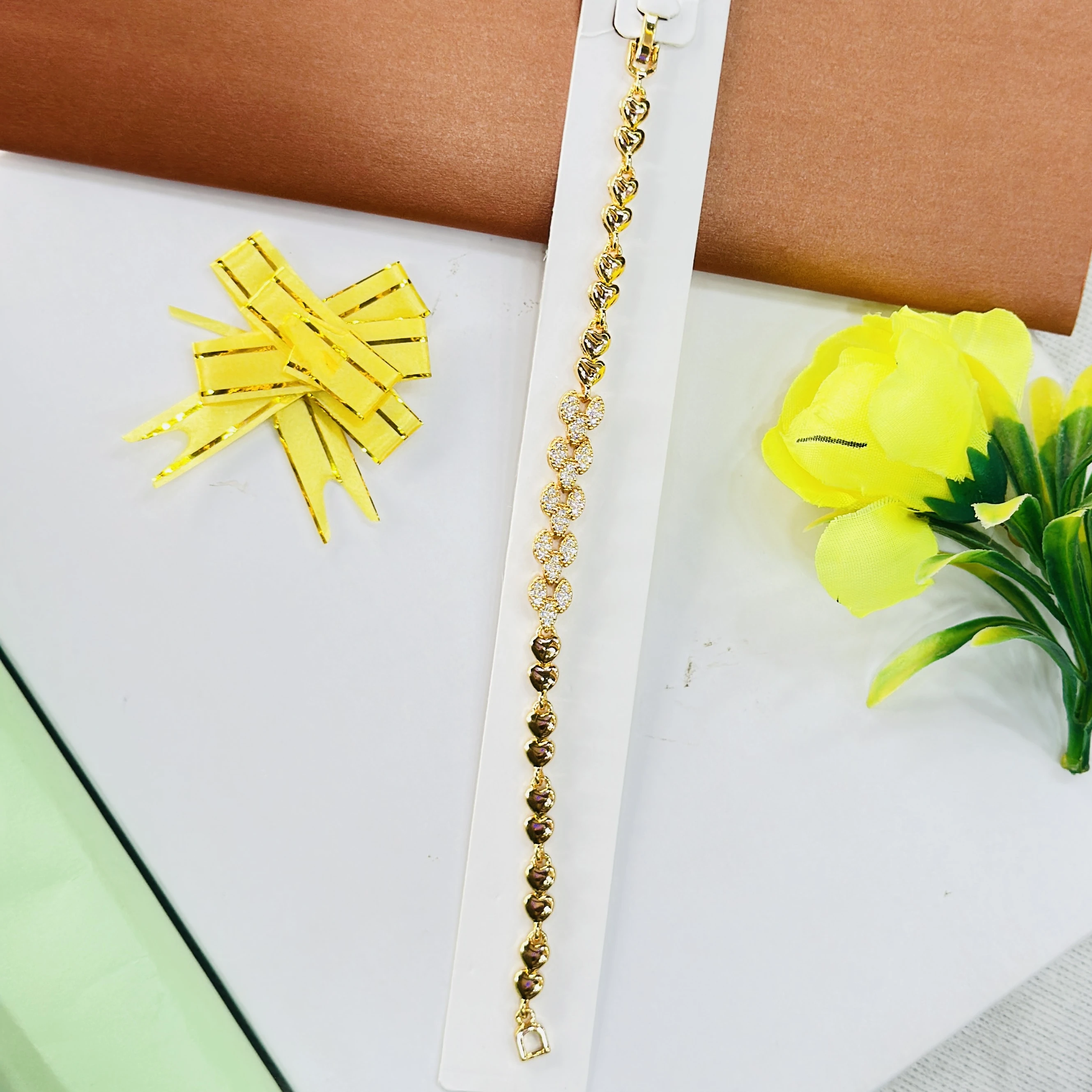 Gold plated bracelet with a heart and crystal design