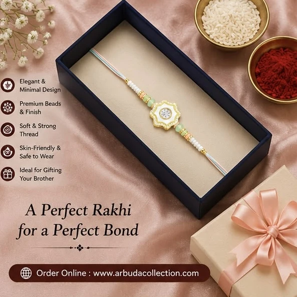 RHOSYN floral rakhi features a white and gold centerpiece with pastel green beads on an adjustable thread.