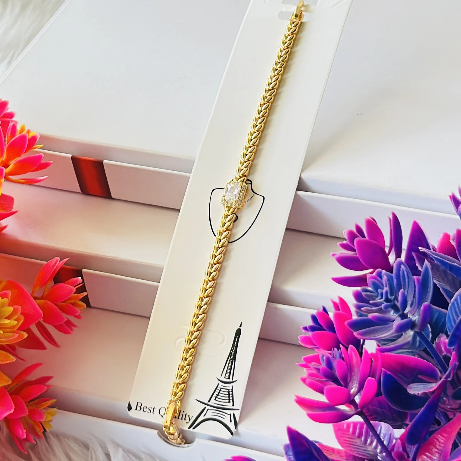 Gold plated bracelet with a central cubic zirconia stone