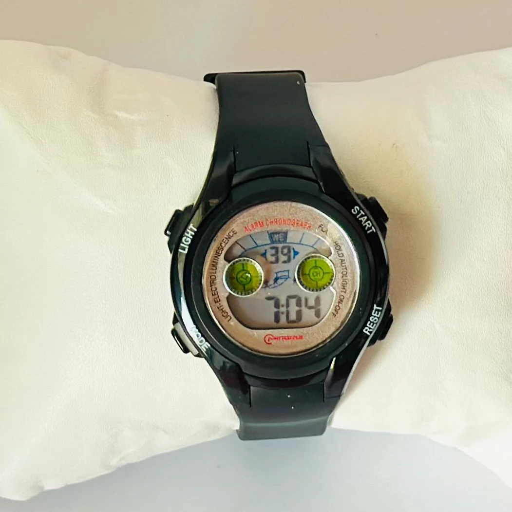 black Mingrui digital sports watch with a plastic or rubber strap.