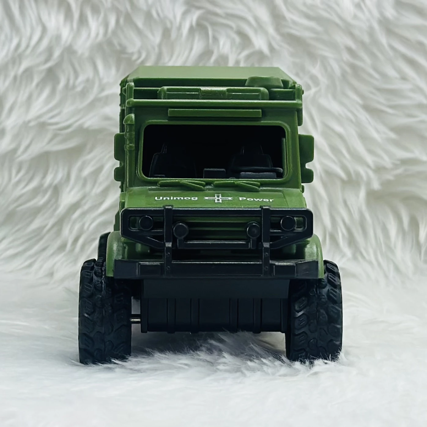 Toy Club Unimog army truck toy.