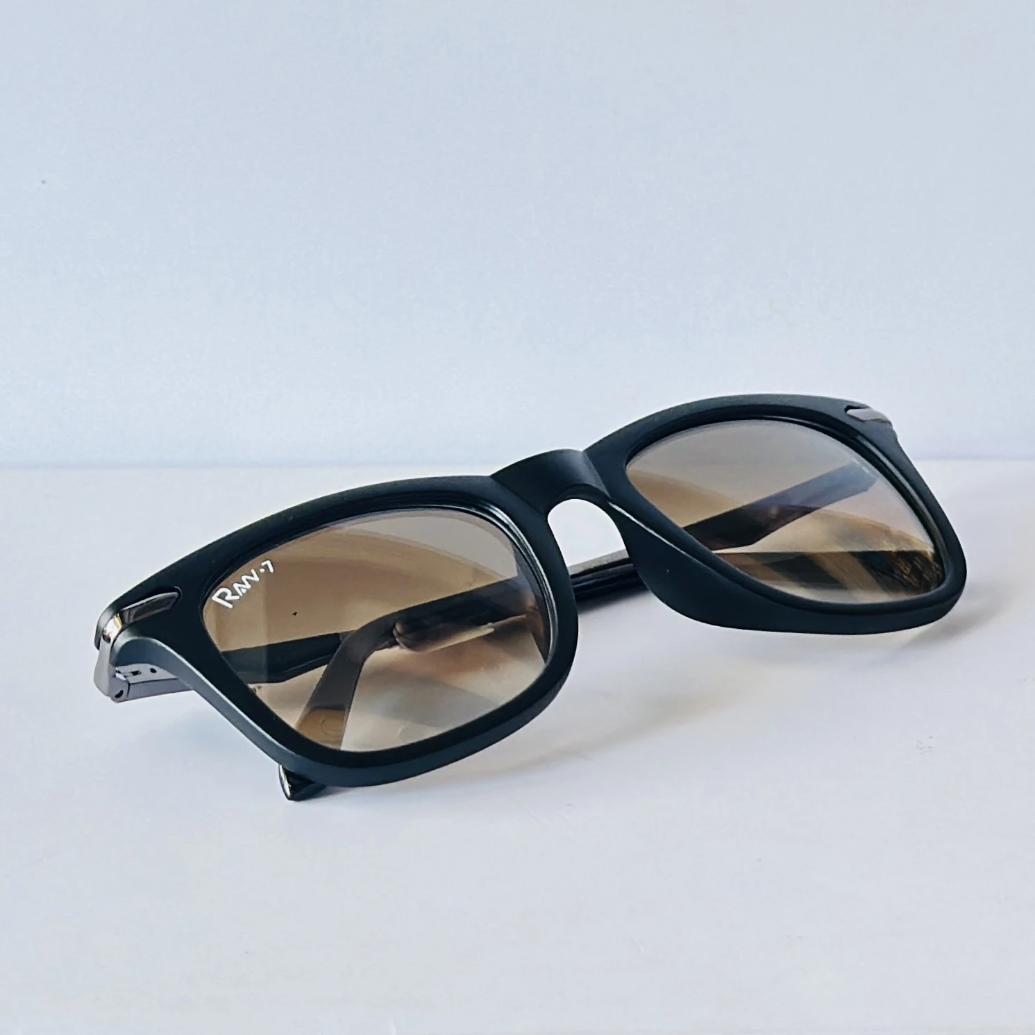 pair of Raw 7 branded men's rectangular sunglasses