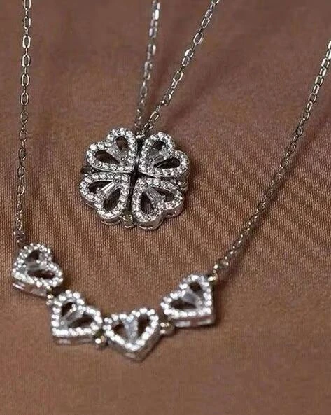 silver-toned, magnetic four-heart clover pendant necklace made of stainless steel