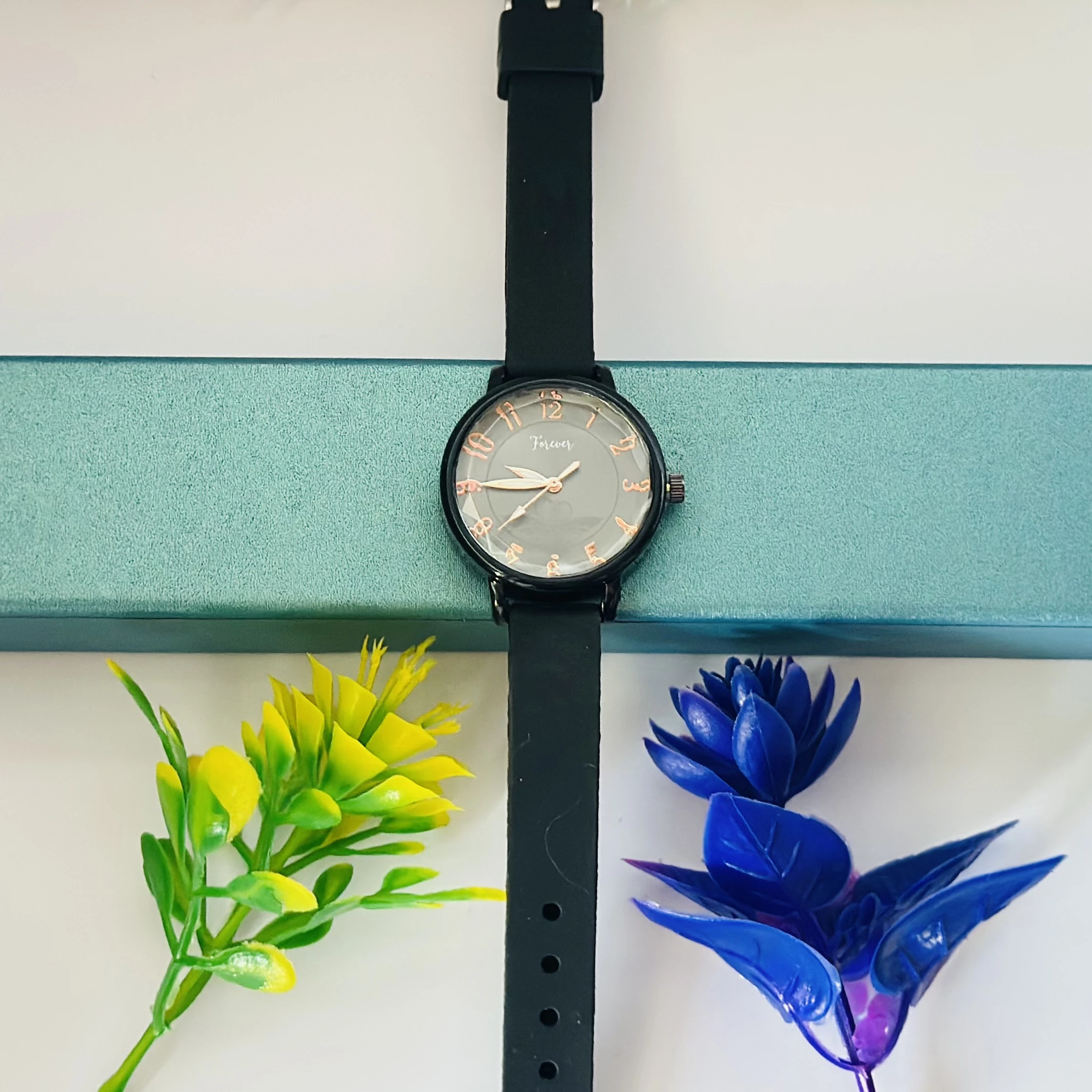 women's analog quartz watch with a white dial and black strap.
