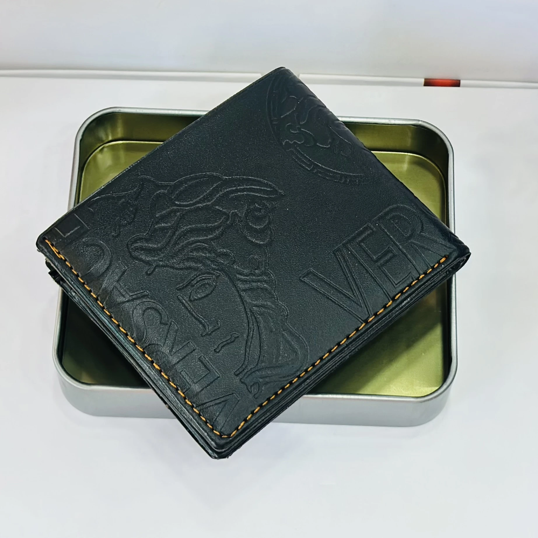 Versace Medusa Biggie bi-fold wallet in black leather.