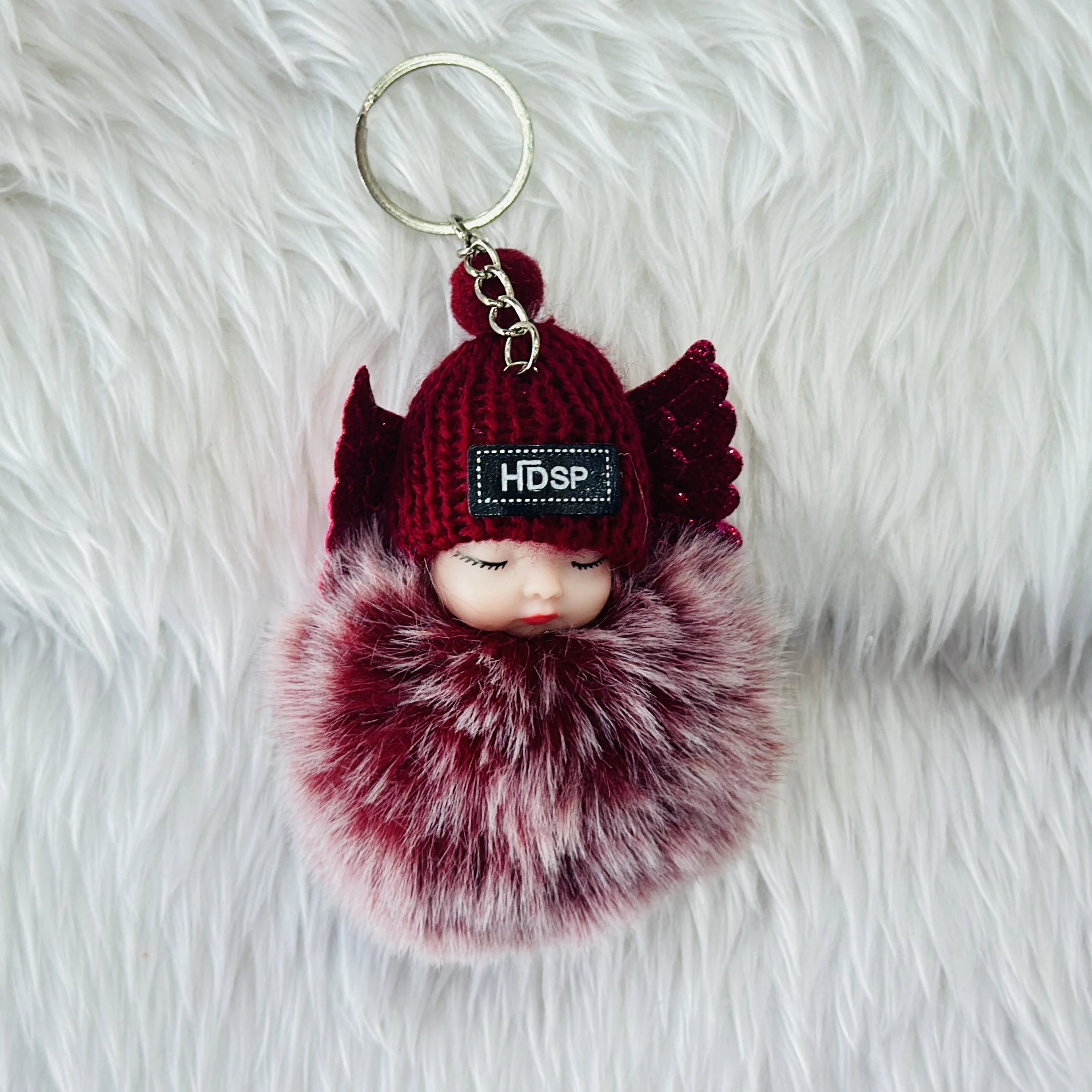 sleeping baby doll keychain