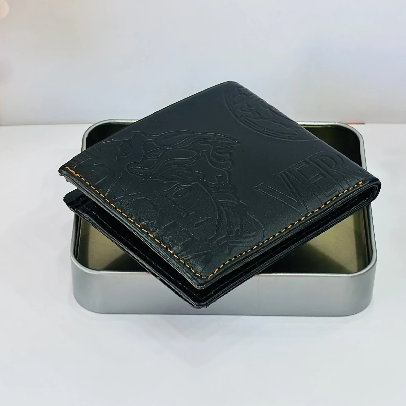 Versace Medusa Biggie bi-fold wallet in black leather.