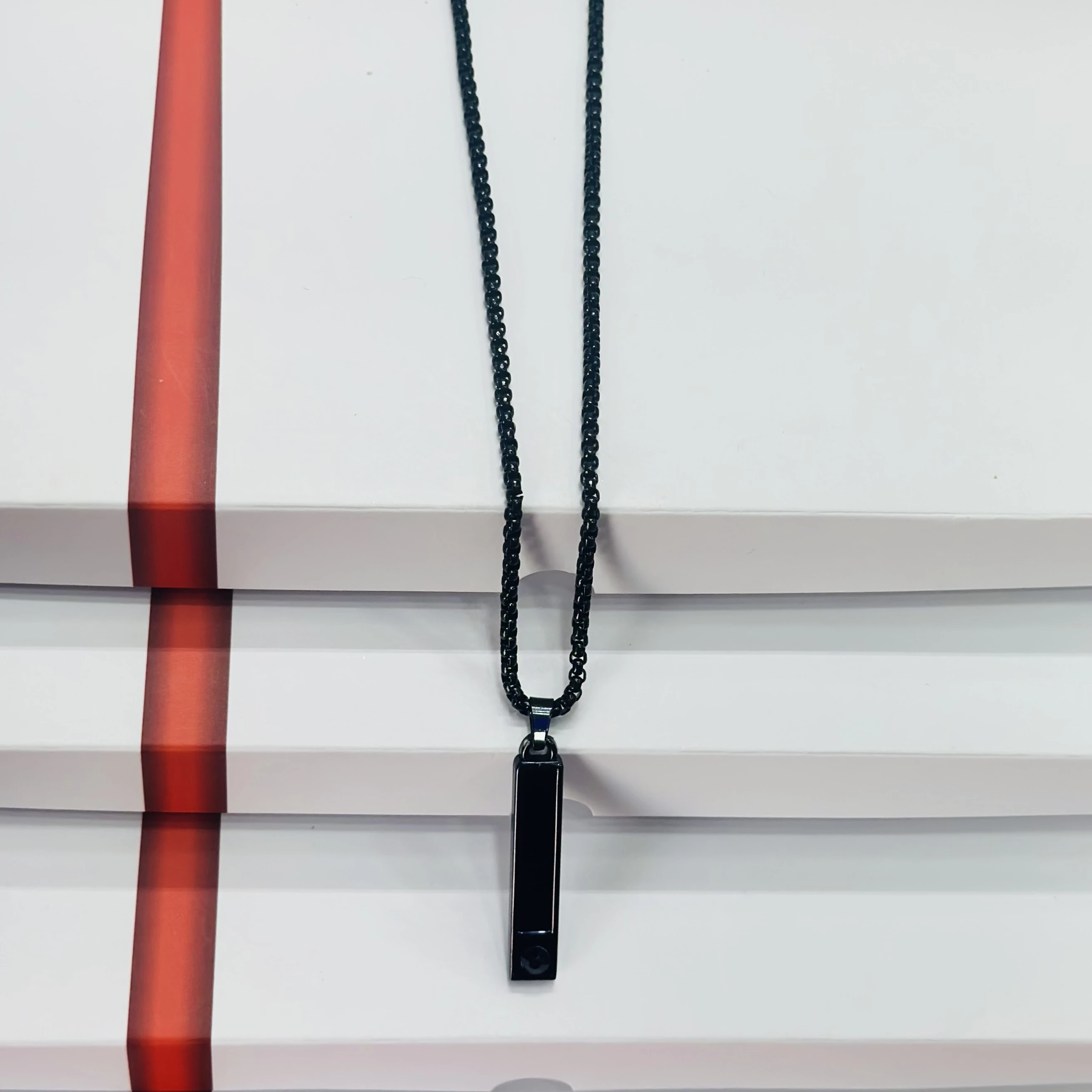 Black stainless steel anxiety relief mindful breathing necklace.