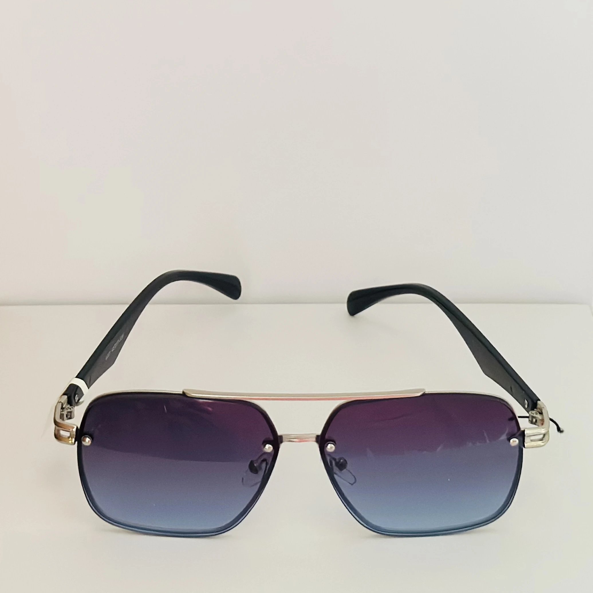 GOGLASSIC GG2317 rectangle sunglasses featuring a silver-tone metal frame and blue gradient UV-protected lenses.