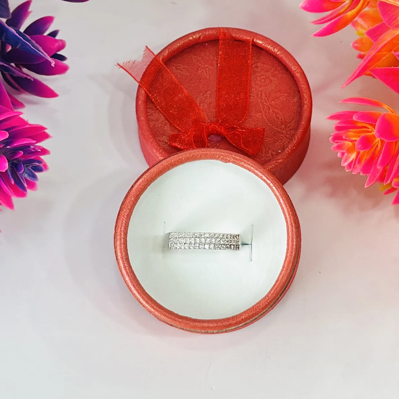 Silver multi-row American diamond band ring.