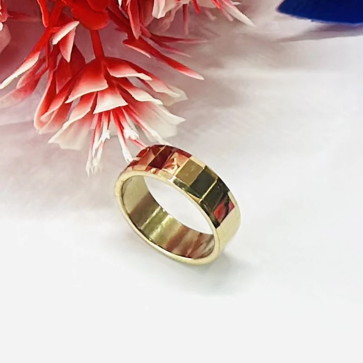 gold-plated highly polished tungsten carbide faceted band ring.