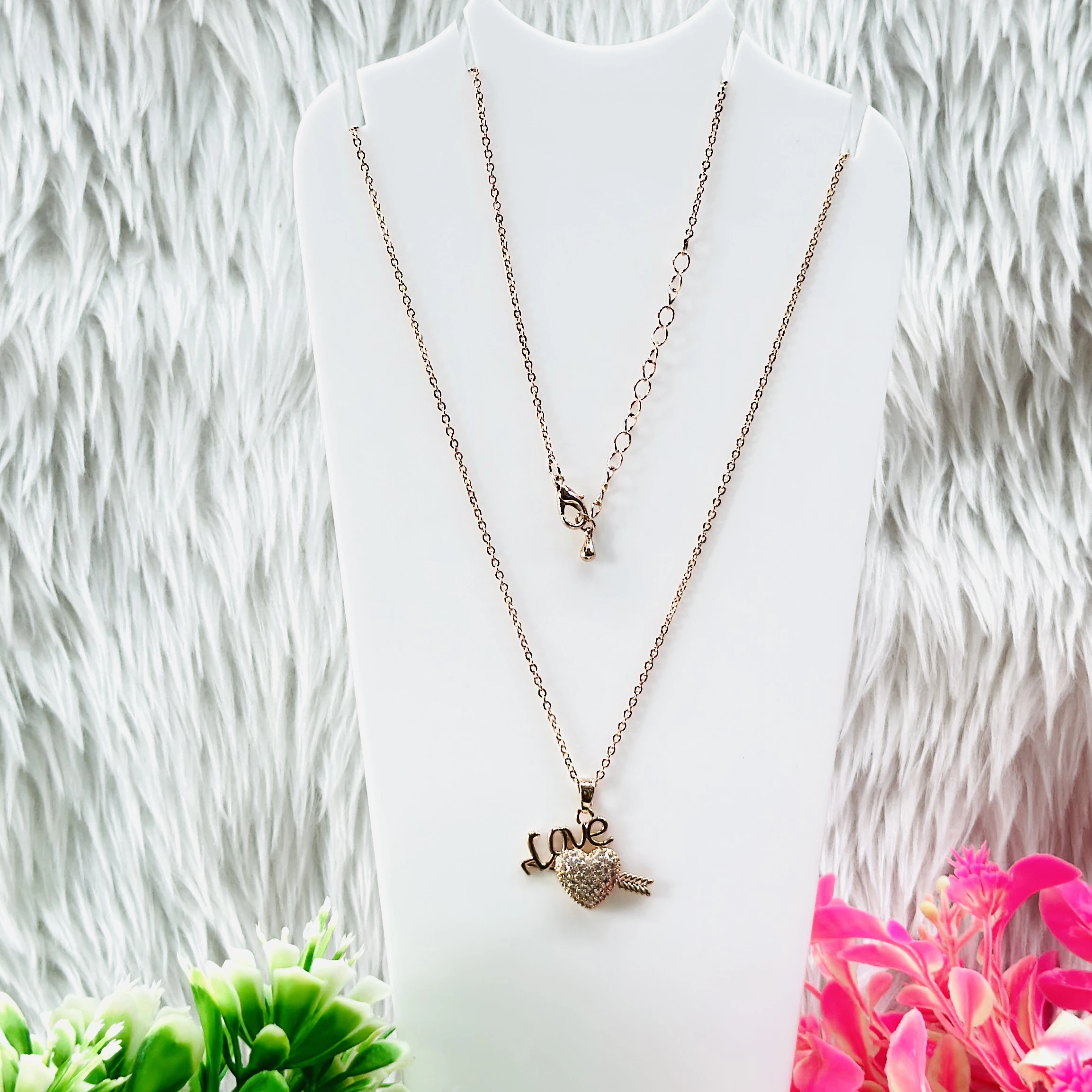 Rose gold necklace set features a heart pendant